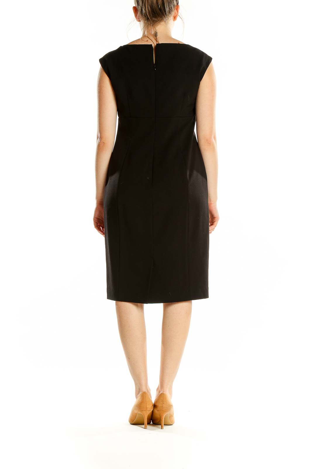 Back view of black Calvin Klein sheath dress showing sleek silhouette and zipper closure