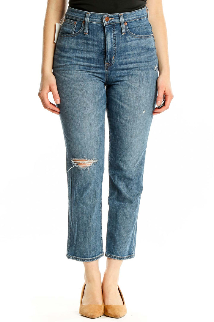 Front view of Madewell blue distressed high-rise cropped jeans