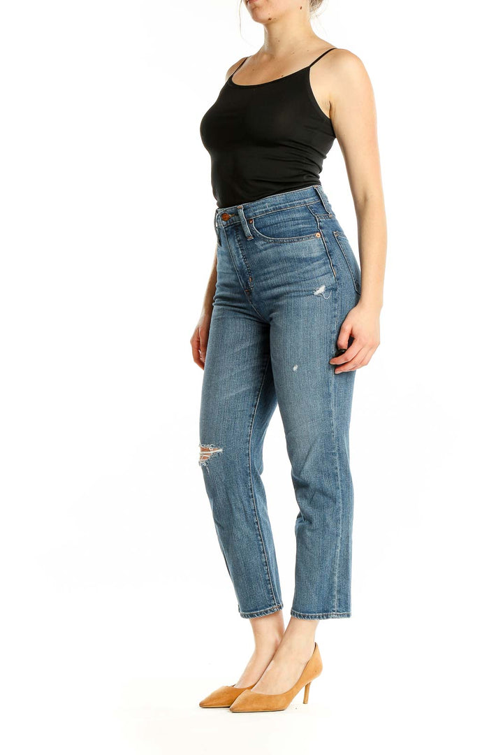 Front view of Madewell blue distressed high-rise cropped jeans