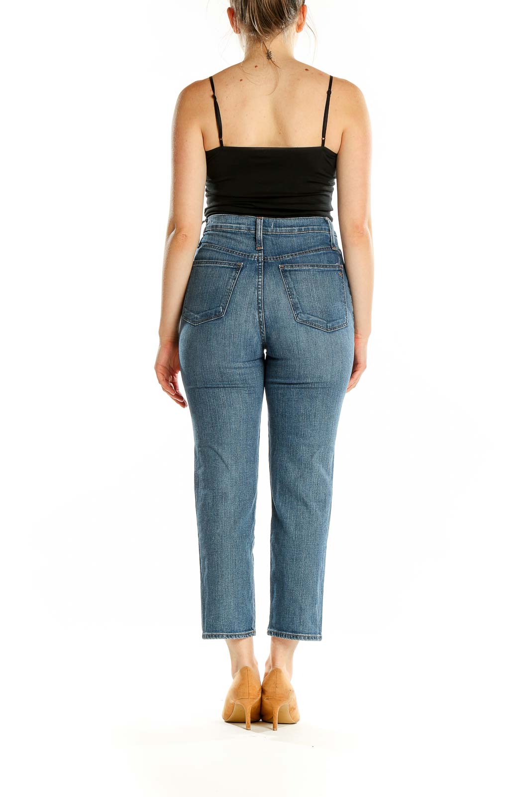 Back view of Madewell blue distressed high-rise cropped jeans