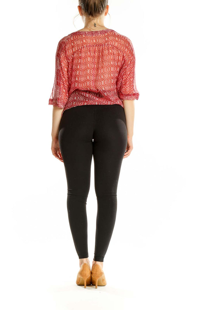 Back view of Isabel Marant Etoile red silk blouse showing geometric pattern