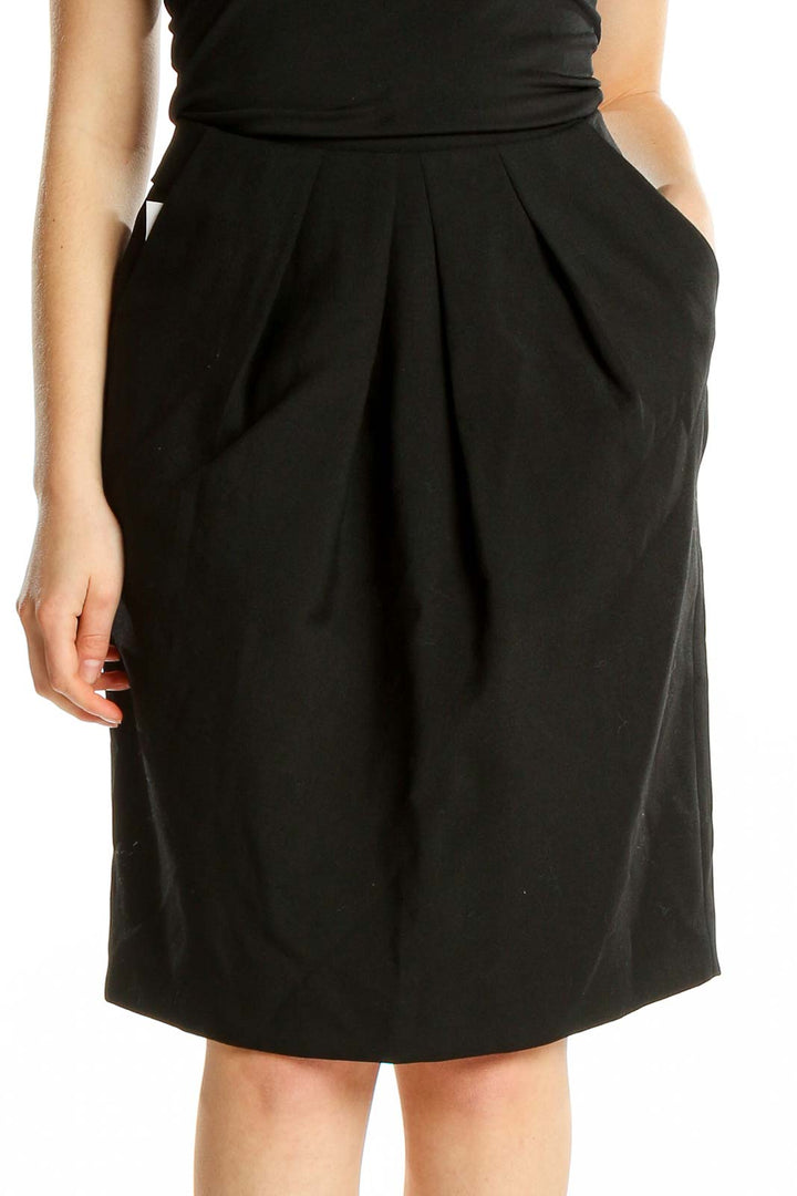 Front view of Jigsaw London black pleated wool blend skirt