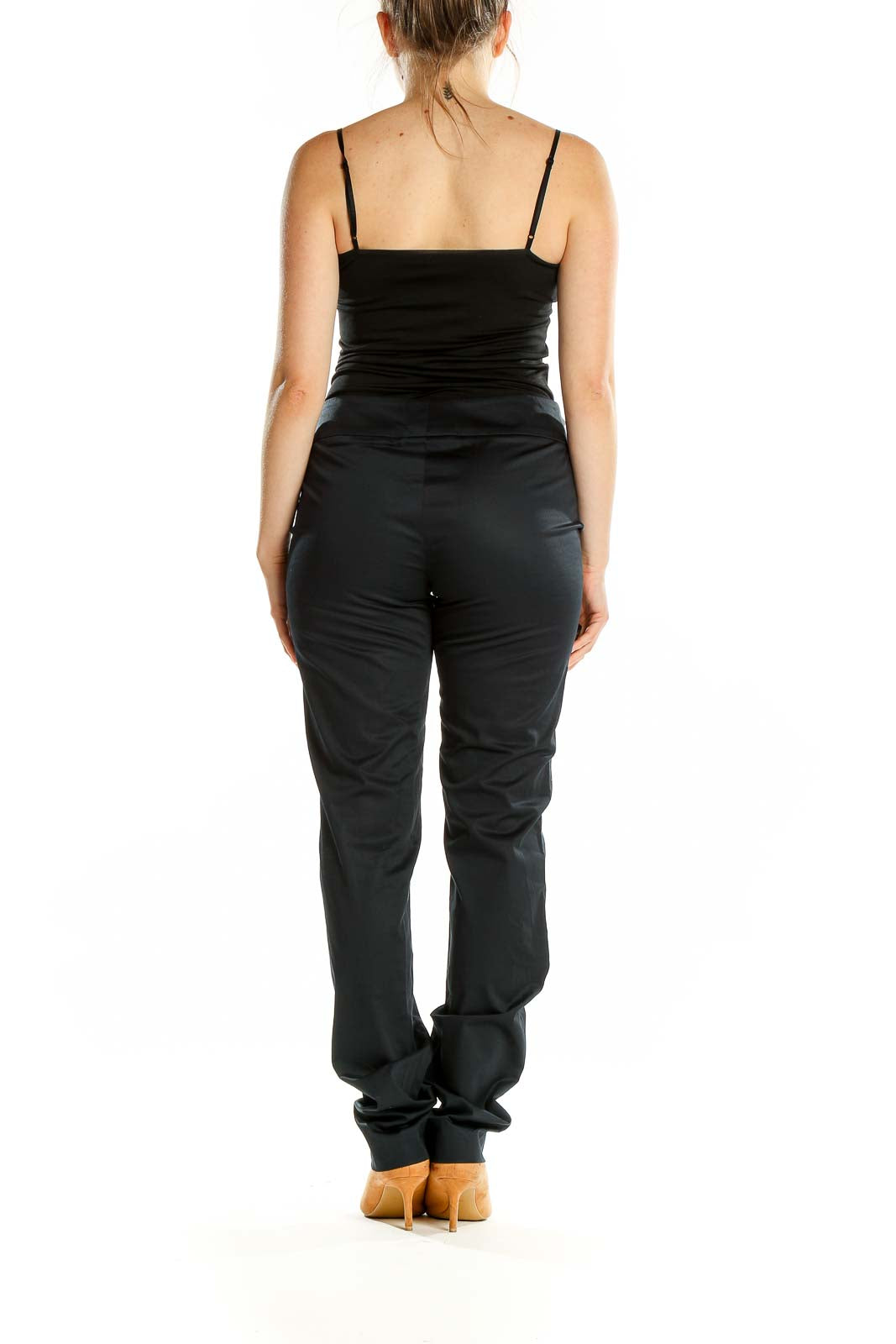 Back view of black slim-fit Worth pants on model