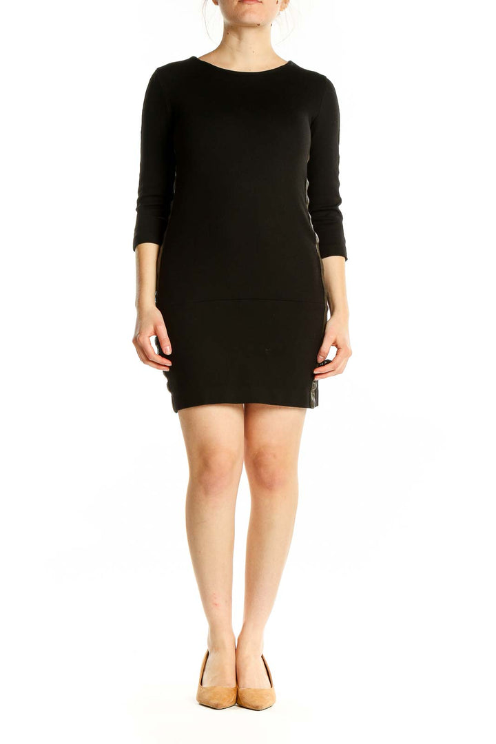 Front view of Sandro black fitted mini dress with lace sleeves