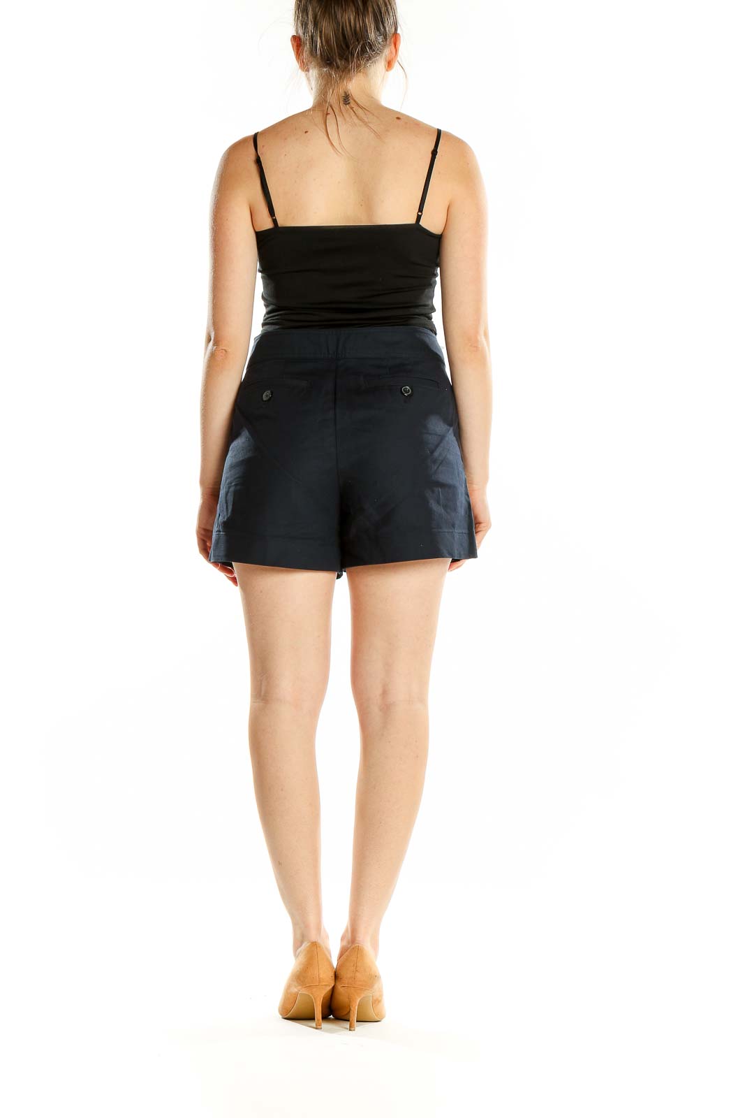 Back view of Ann Taylor navy tailored shorts on model