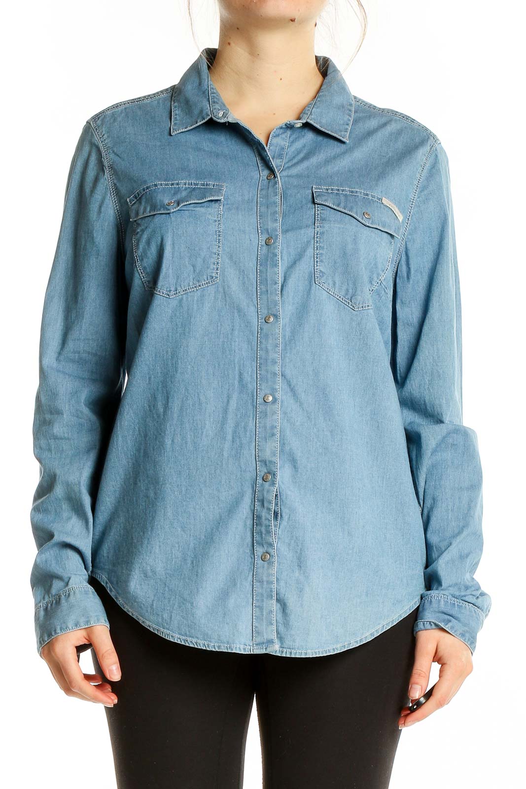 Front view of Calvin Klein Jeans light blue denim button-up shirt with chest pockets