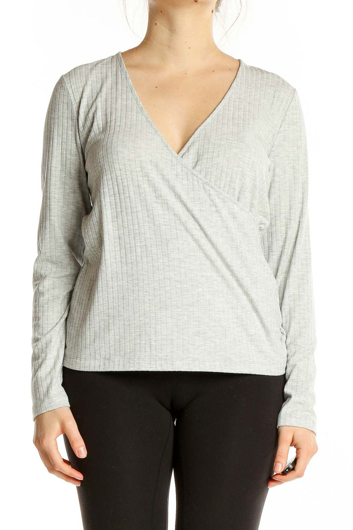 Front view of gray ribbed wrap top from Banana Republic