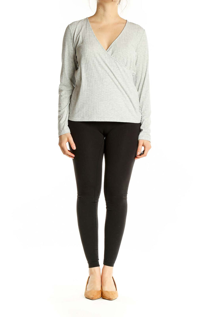 Front view of gray ribbed wrap top from Banana Republic