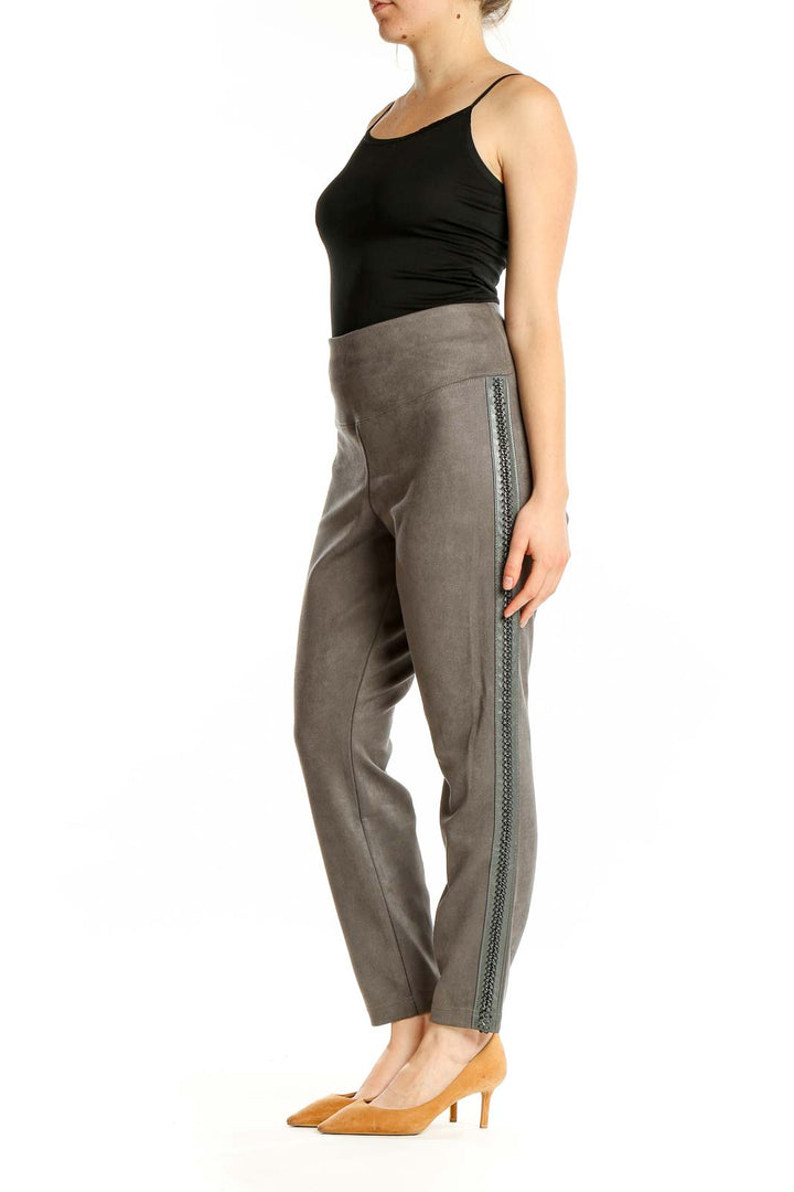 Front view of gray suede-like ankle pants with embellished sides from White House Black Market