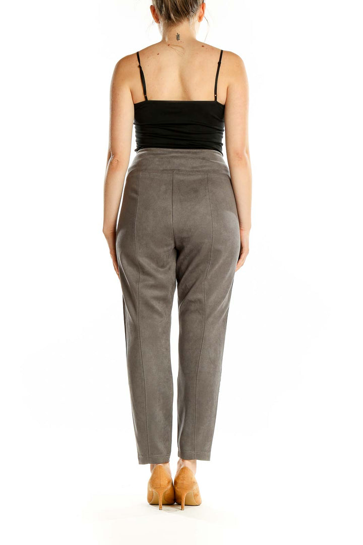 Back view of gray suede-like ankle pants from White House Black Market on model