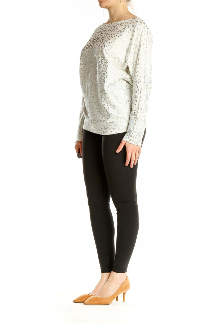 Front view of Boston Proper white leopard print long sleeve top with boat neckline