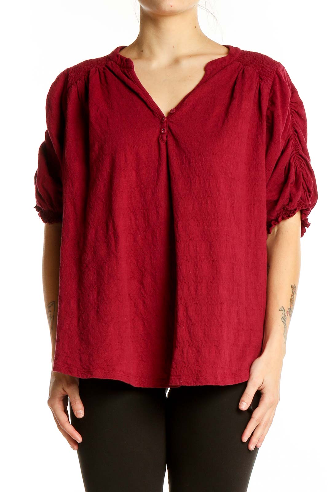 Front view of red Free People peasant blouse with ruched sleeves