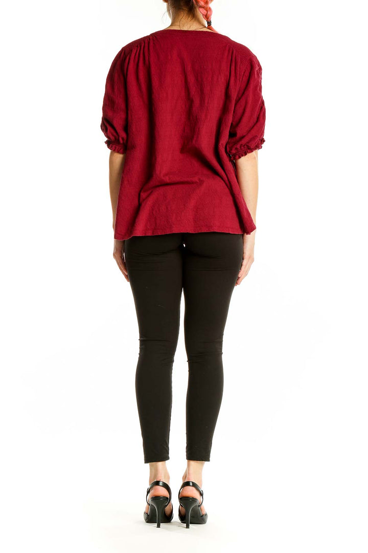 Back view of red Free People peasant blouse showing relaxed fit