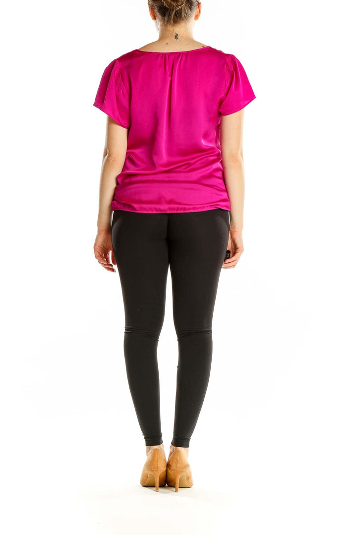 Back view of hot pink Ann Taylor short-sleeve blouse on model