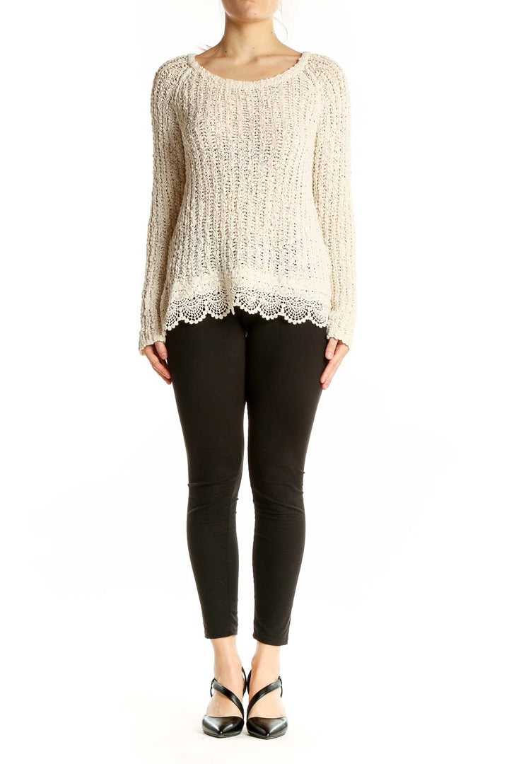 Front view of cream knitted cotton sweater with lace trim by KNITTED & KNOTTED