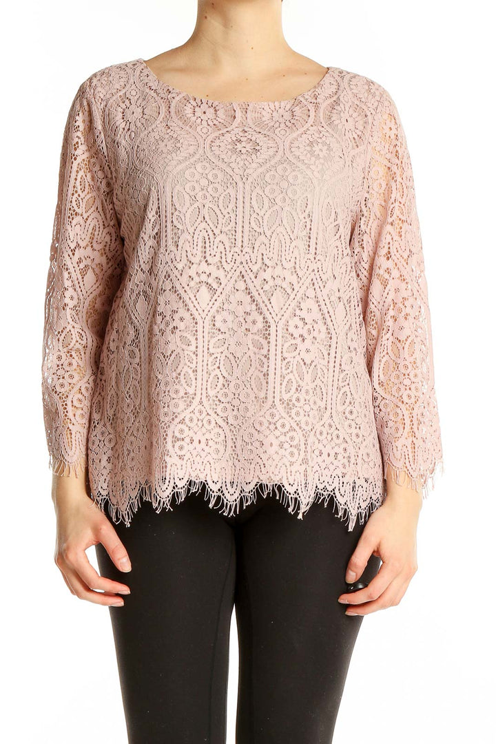 Front view of Ann Taylor LOFT blush pink lace top with long sleeves