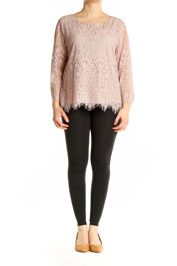 Front view of Ann Taylor LOFT blush pink lace top with long sleeves