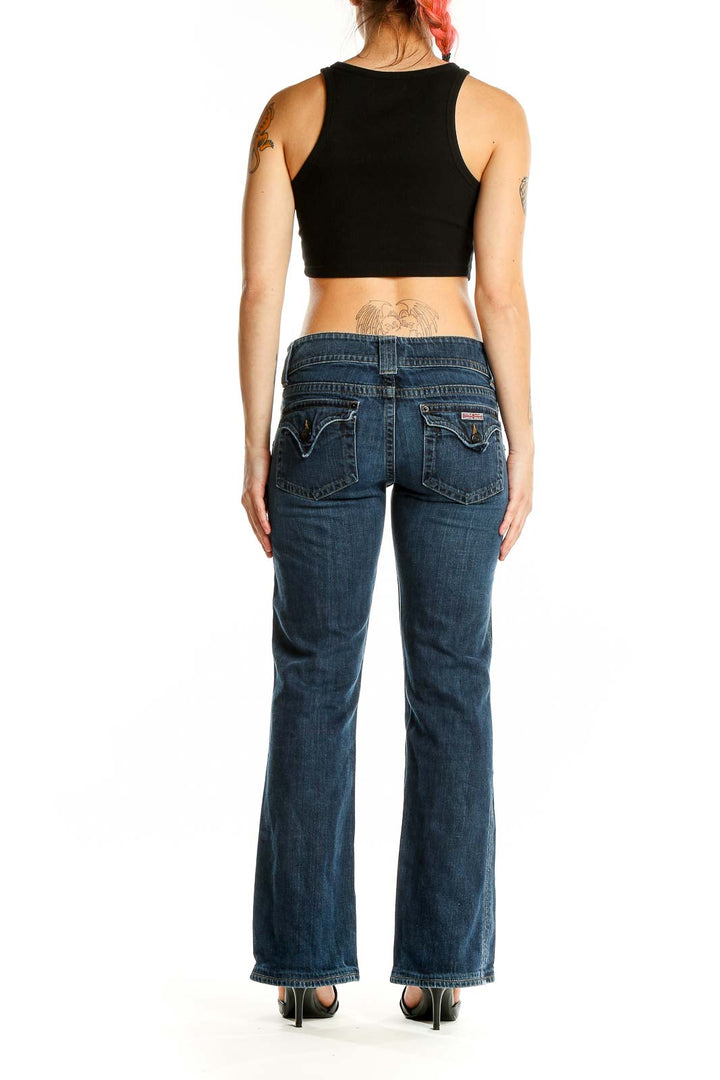 Back view of dark blue flared jeans from Hudson Jeans on a woman