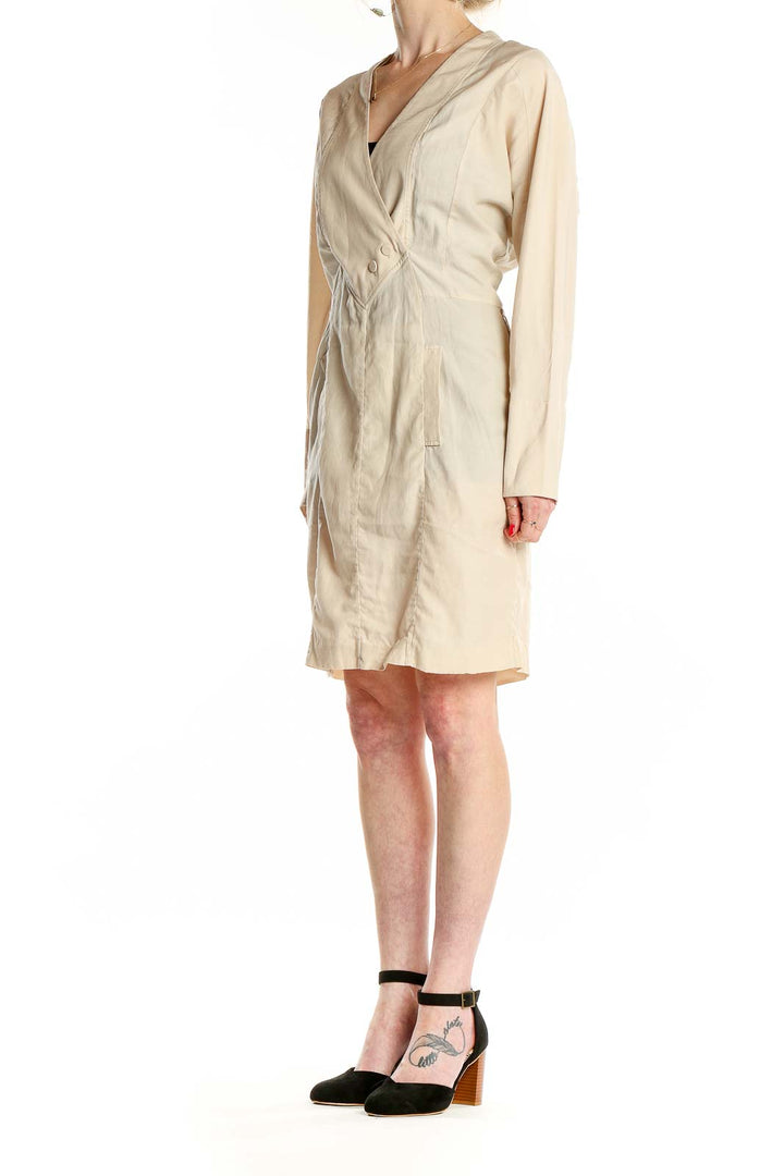 Front view of beige BCBG MaxAzria wrap dress with V-neckline and long sleeves