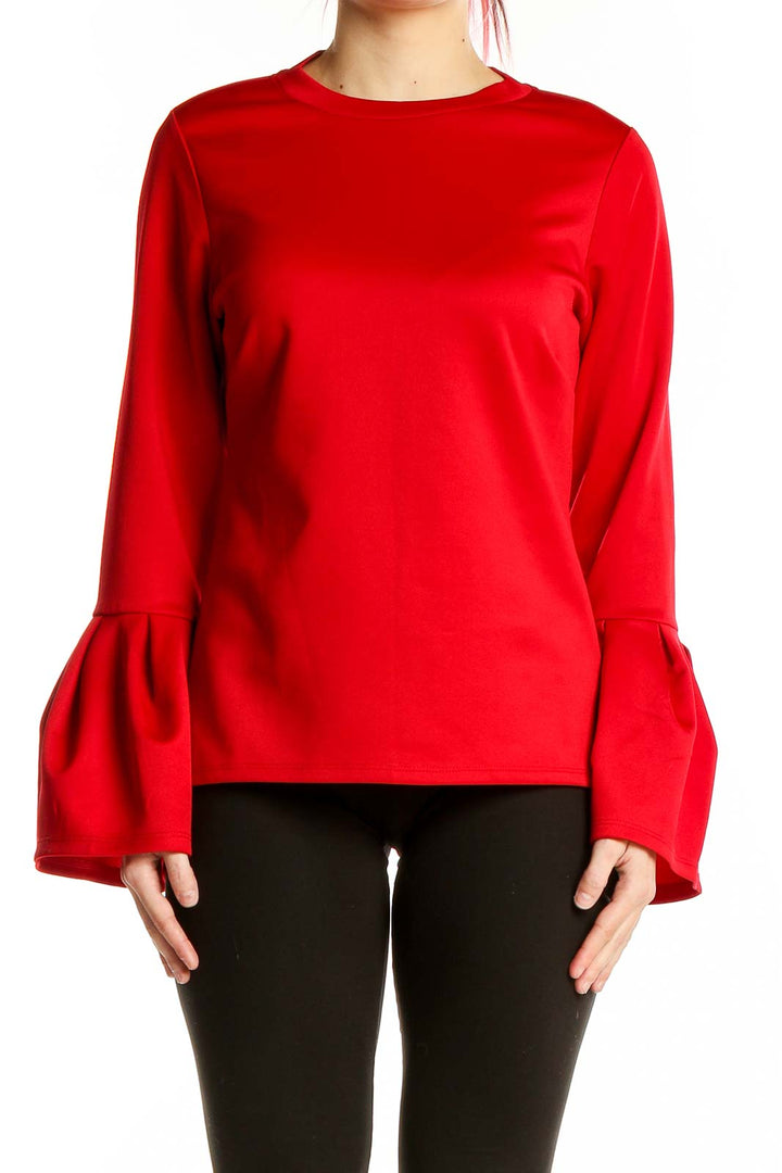 Front view of red Halogen blouse with bell sleeves