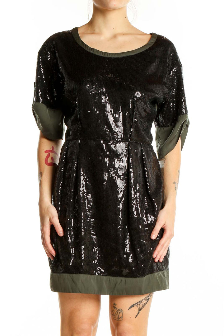 Front view of black sequin cocktail dress with olive trim by Luxe Apothetique