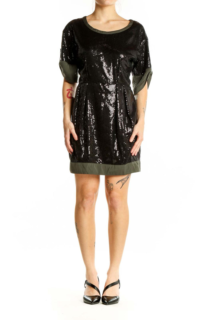 Front view of black sequin cocktail dress with olive trim by Luxe Apothetique