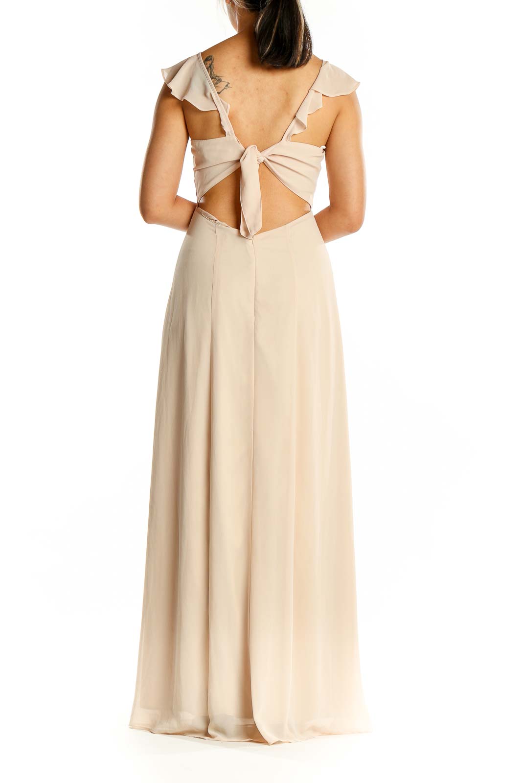 Back view of beige BHLDN Anthropologie maxi dress showing open back design with tie closure