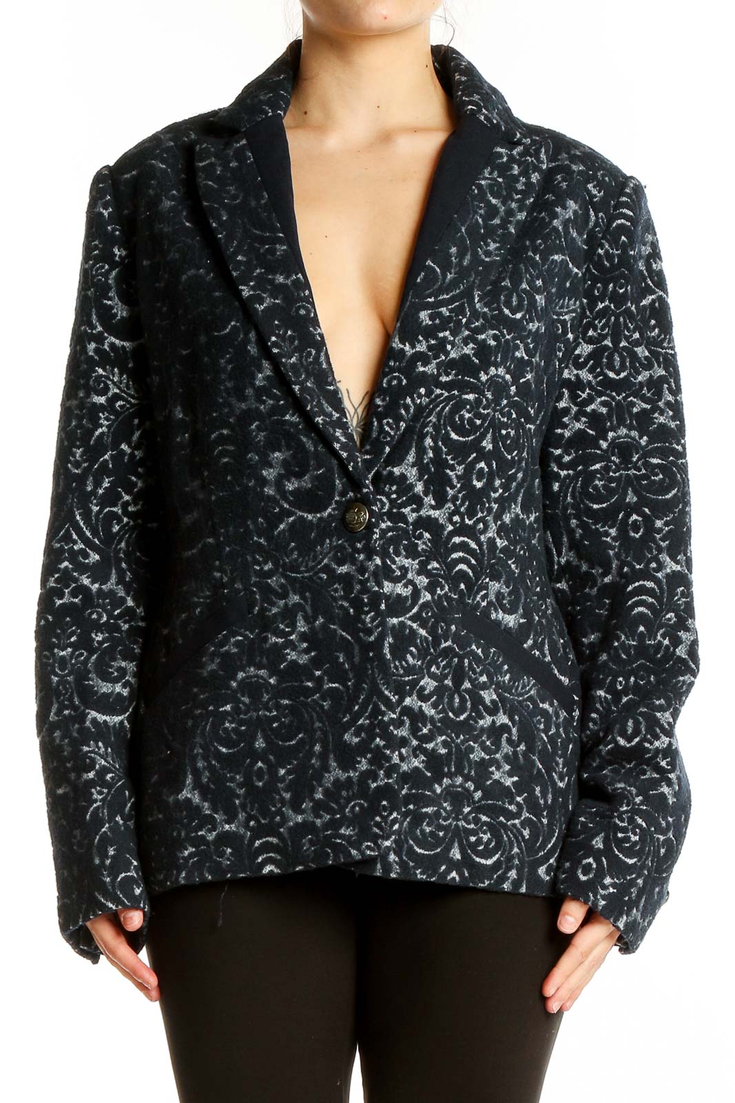 Front view of Cabi black floral jacquard blazer with single button closure