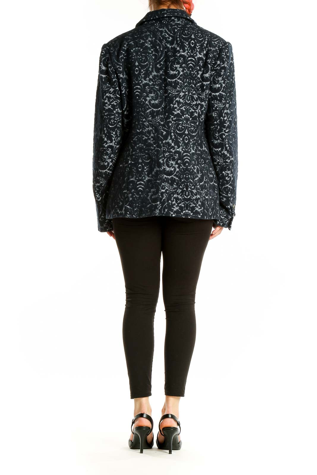 Back view of Cabi black floral jacquard blazer showing intricate pattern