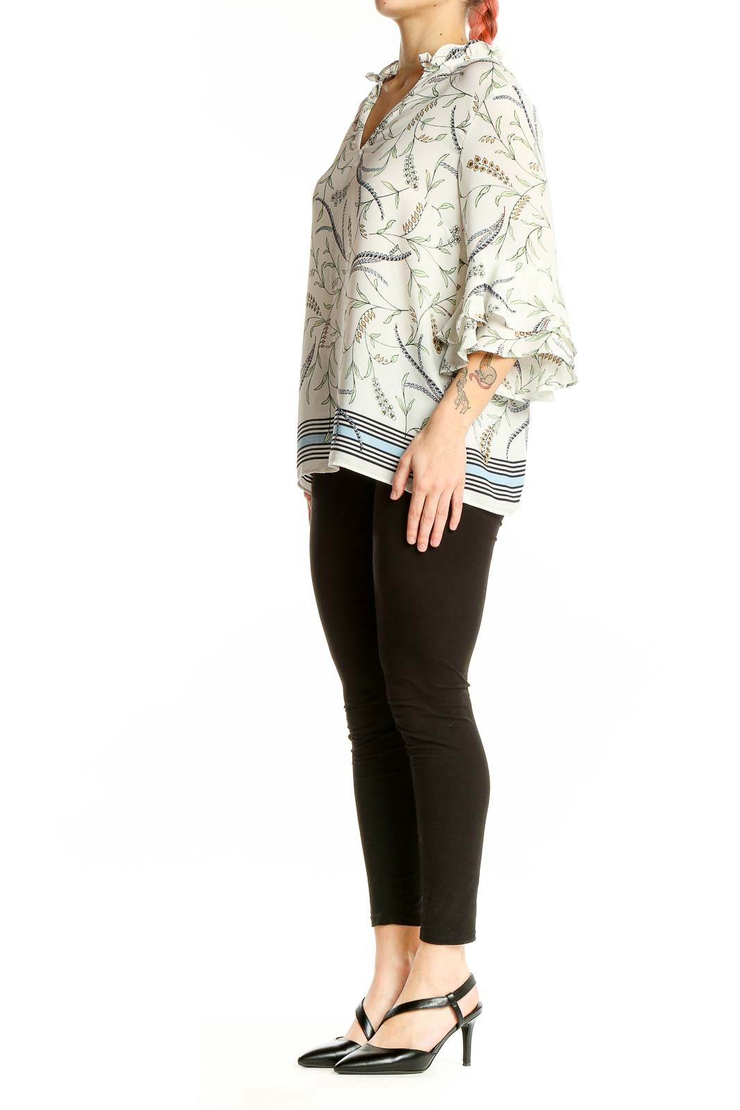 Front view of white floral print blouse with ruffle-neck and bell sleeves