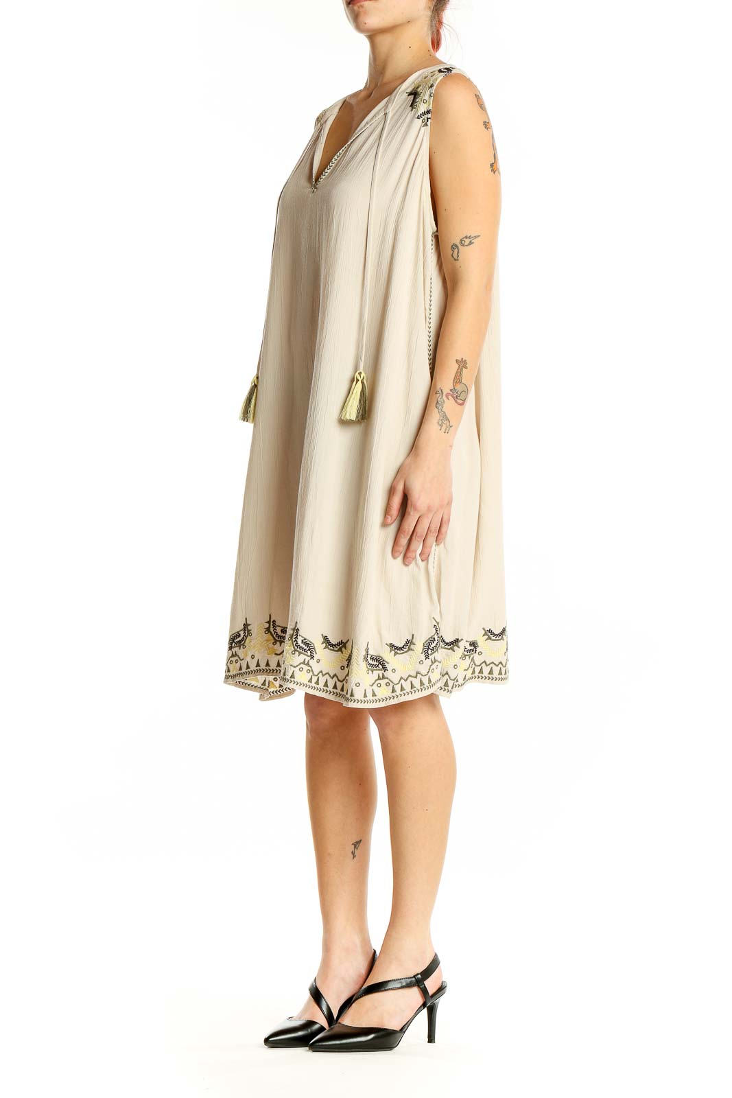 Front view of beige LOFT Outlet LOUNGE sleeveless shift dress with black embroidery