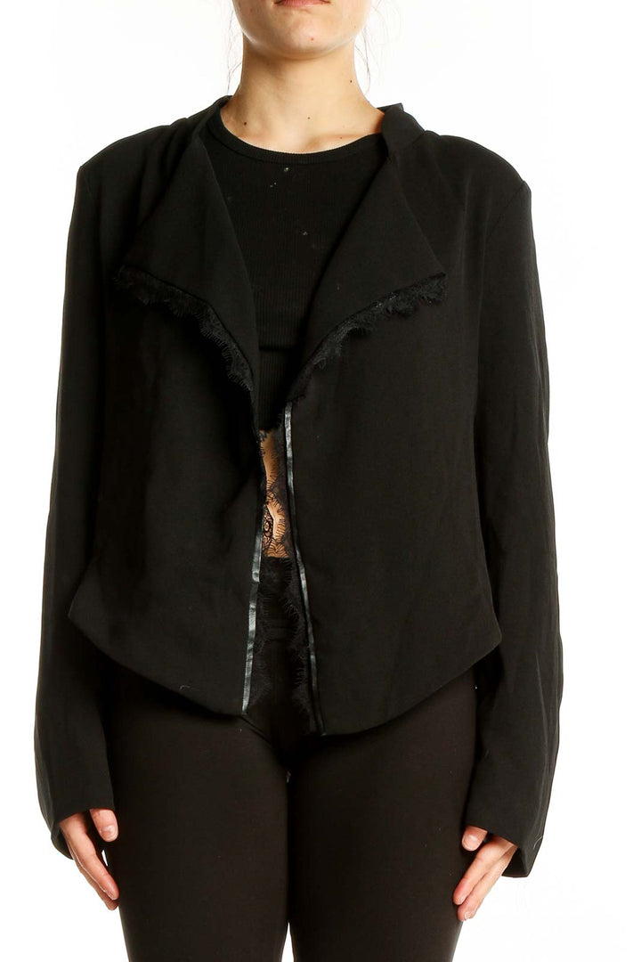 Front view of Elevenses black open-front jacket with cascading lapel