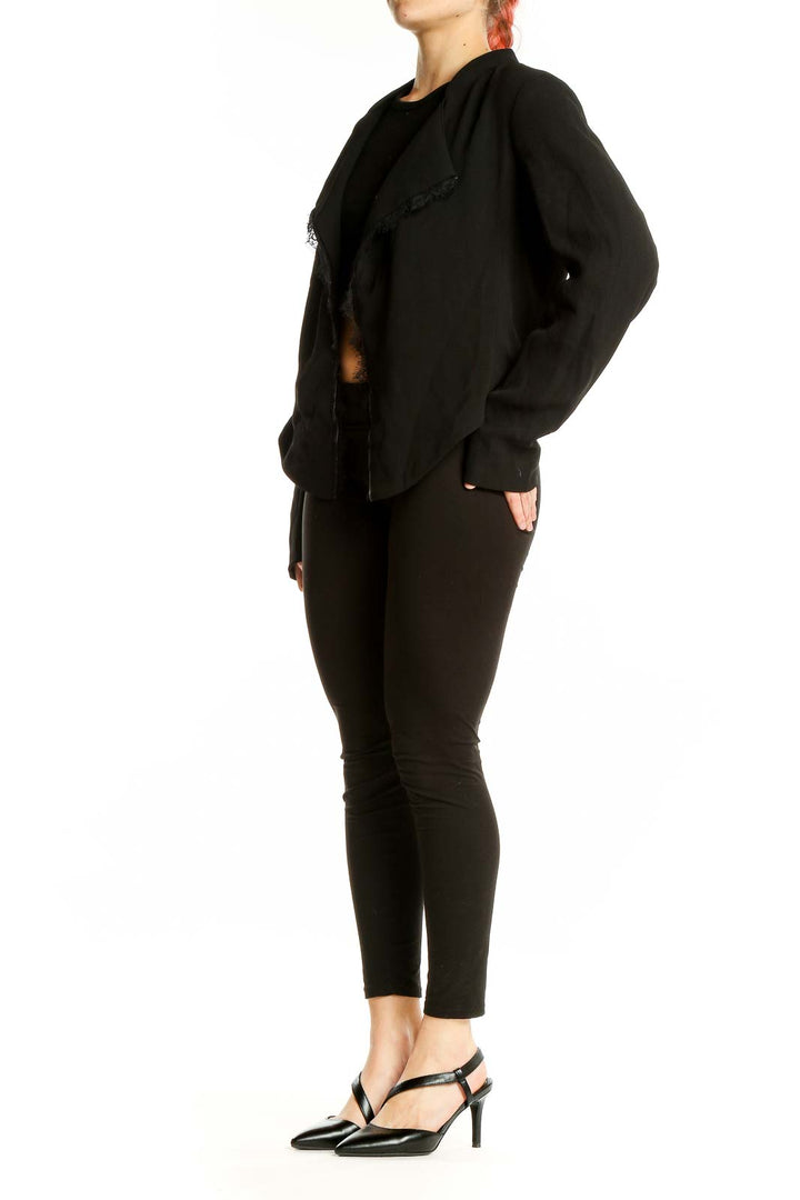 Front view of Elevenses black open-front jacket with cascading lapel