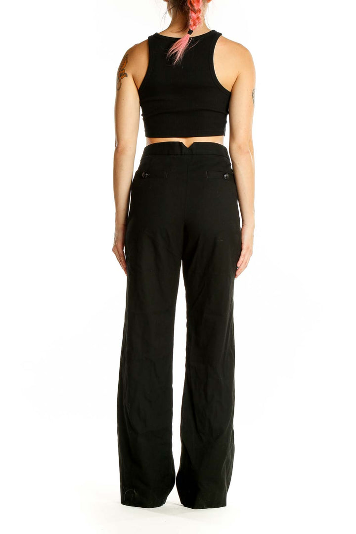 Back view of Banana Republic black wide-leg dress pants on model