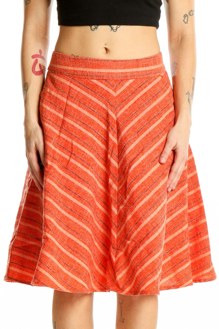 Front view of Harlyn orange striped A-line midi skirt with chevron pattern