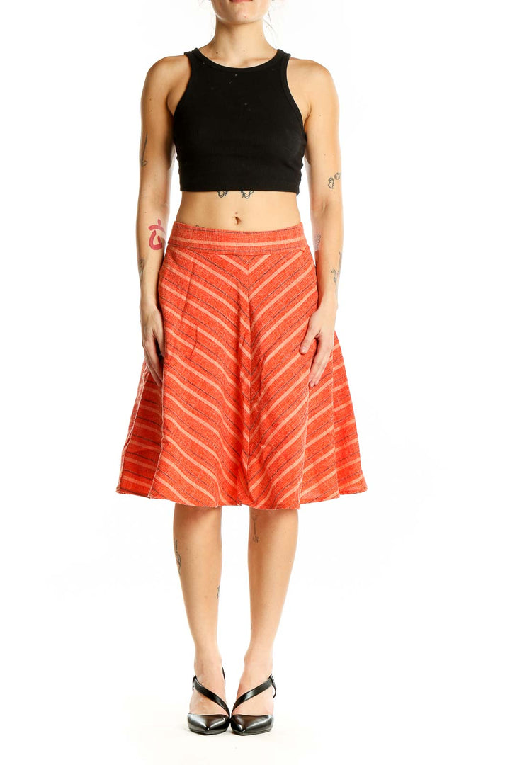 Front view of Harlyn orange striped A-line midi skirt with chevron pattern