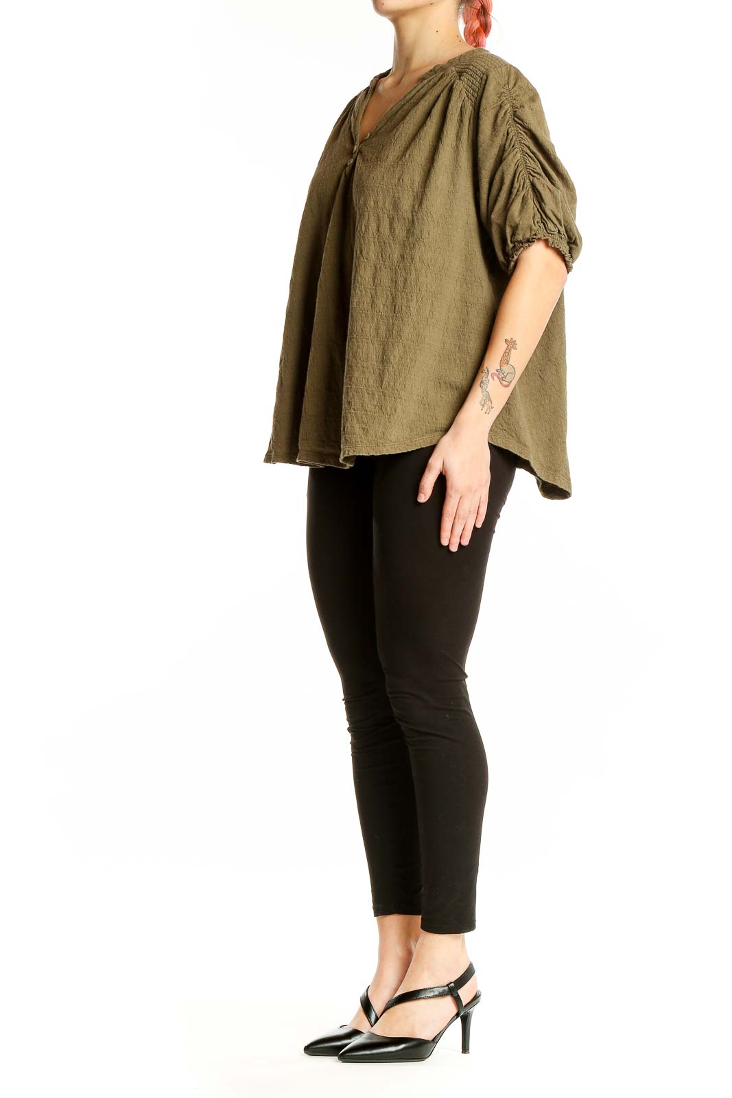 Front view of olive Free People peasant blouse with gathered neckline and billowy sleeves