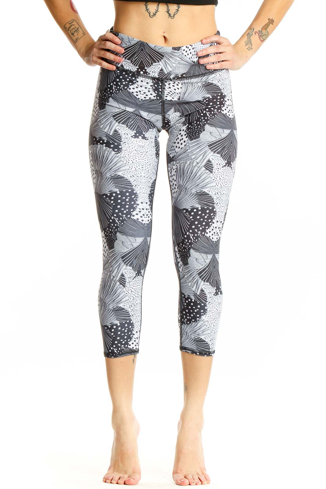 Front view of Becca gray patterned capri leggings on model