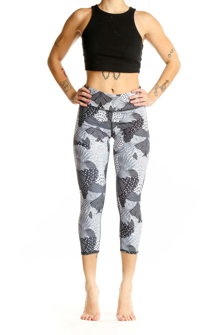 Front view of Becca gray patterned capri leggings on model