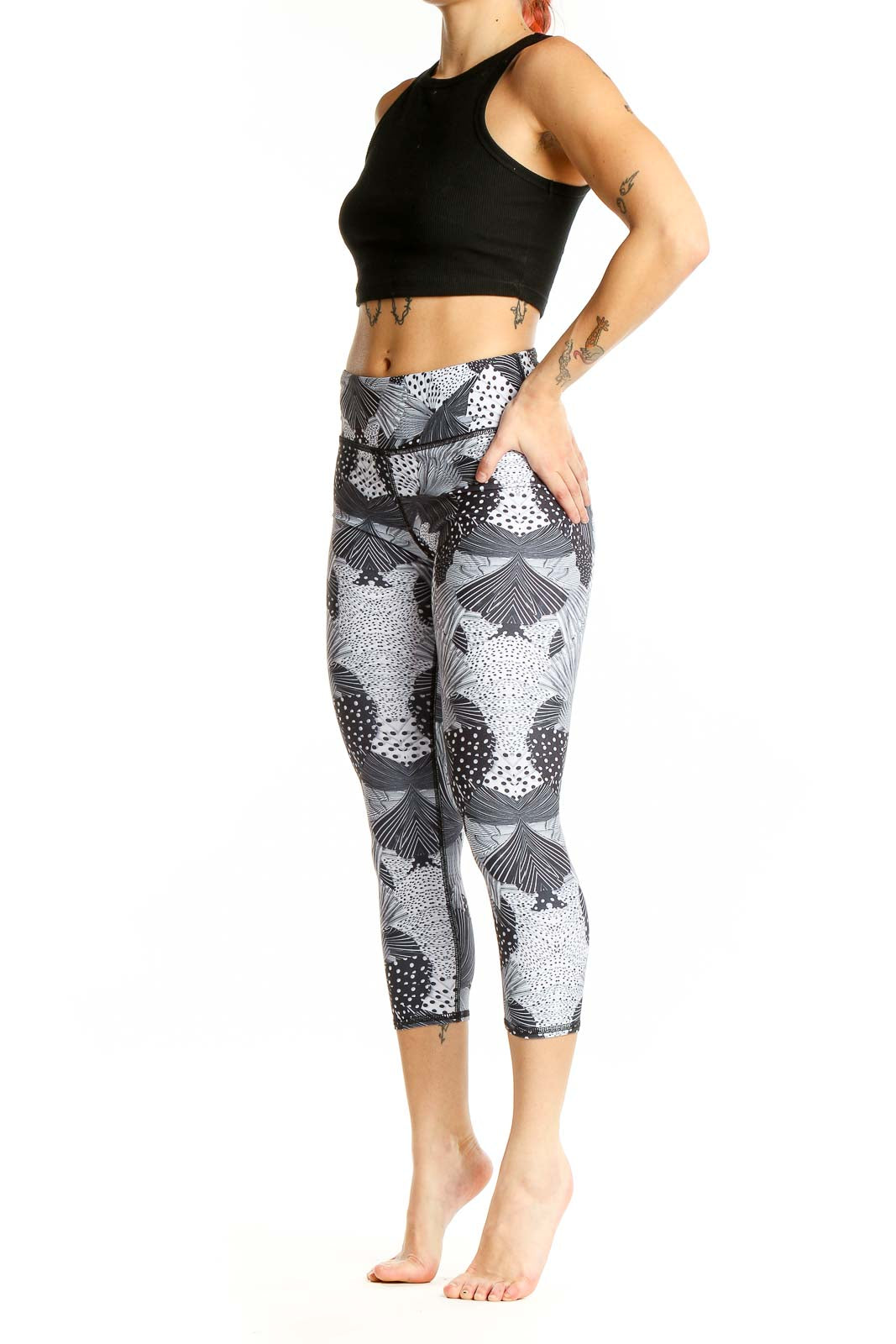 Front view of Becca gray patterned capri leggings on model