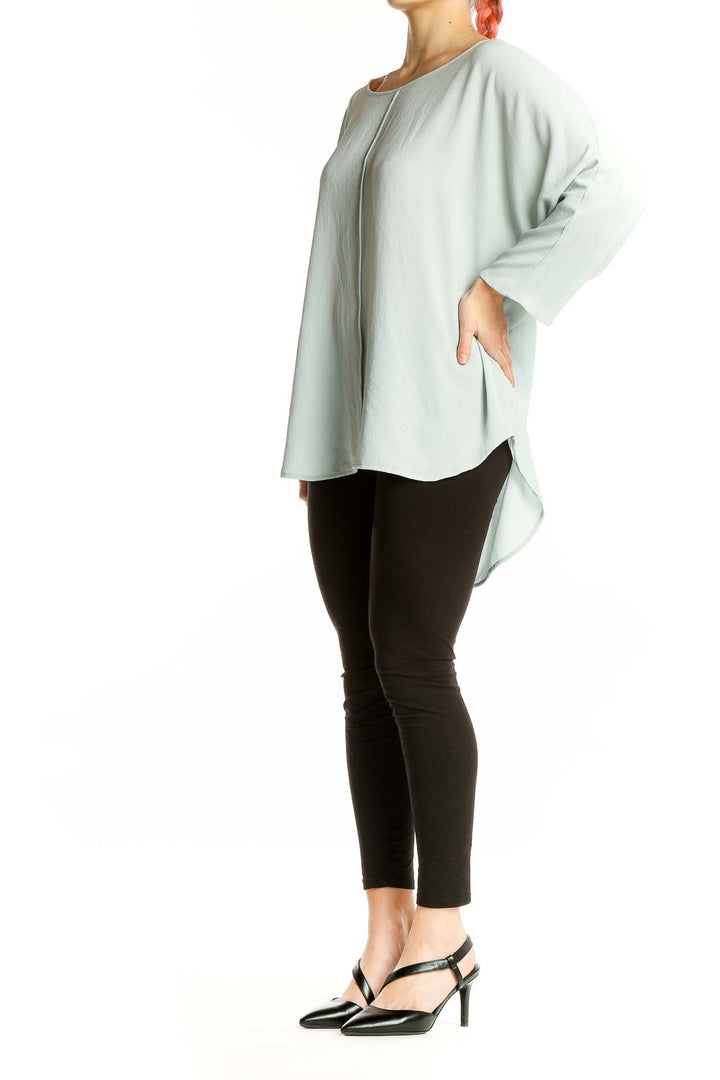 Front view of Vince Camuto mint green oversized top with batwing sleeves