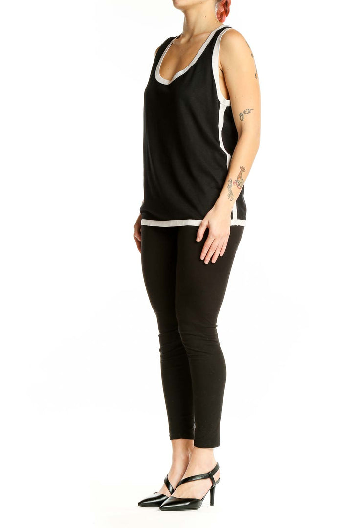 Front view of Ann Taylor black tank top with white trim