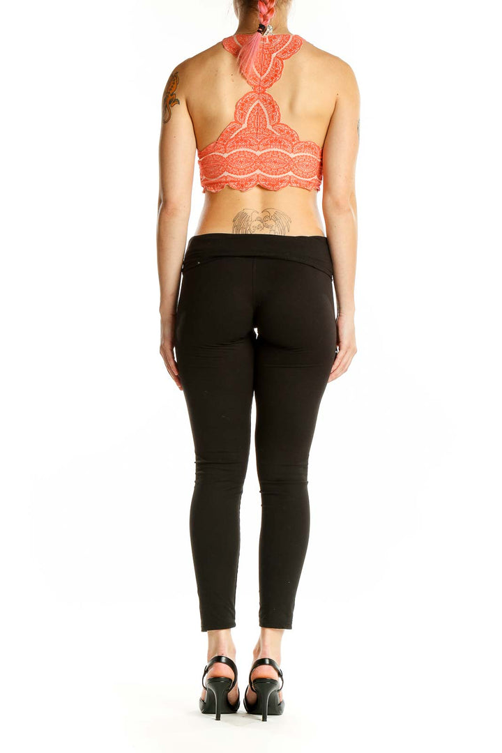 Back view of coral lace racerback bralette showing intricate lace pattern