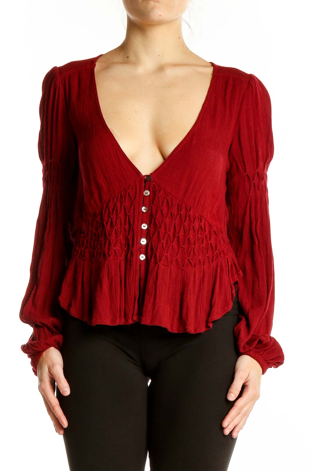 Front view of red rayon smocked peplum top from Free People