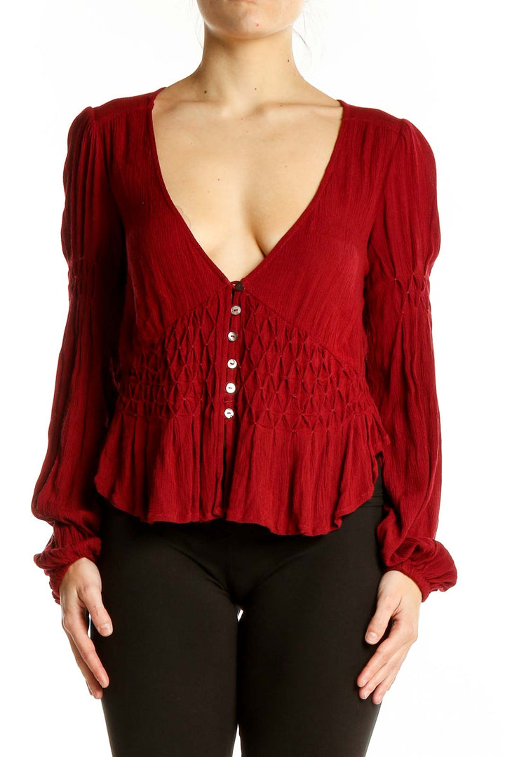 Front view of red rayon smocked peplum top from Free People