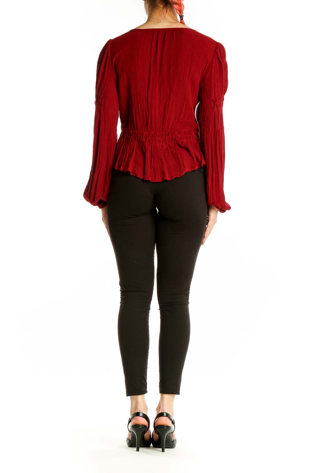 Back view of red rayon smocked peplum top from Free People