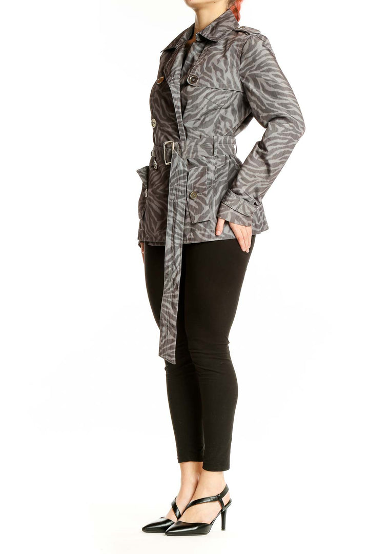 Front view of Nine West gray zebra print trench coat with double-breasted buttons and belt