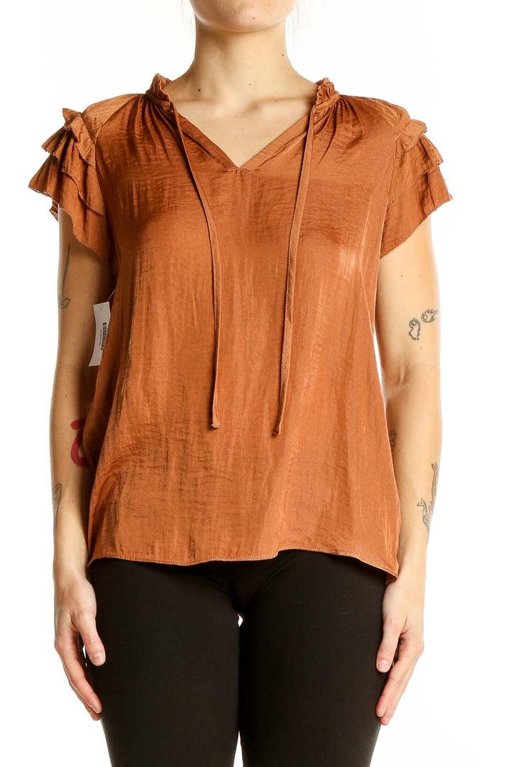 Front view of Rachel Zoe terracotta blouse with V-neck and ruffled cap sleeves