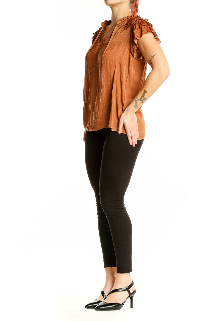 Front view of Rachel Zoe terracotta blouse with V-neck and ruffled cap sleeves