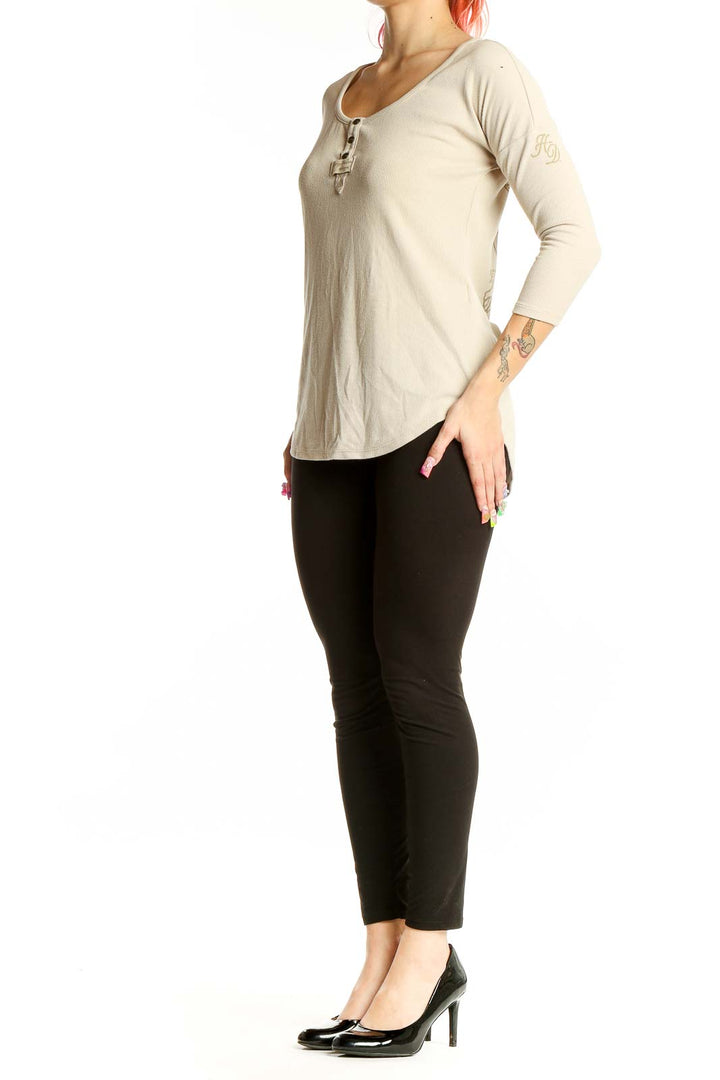 Front view of beige ribbed Harley Davidson Henley top